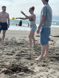 Playing spike ball on the beach