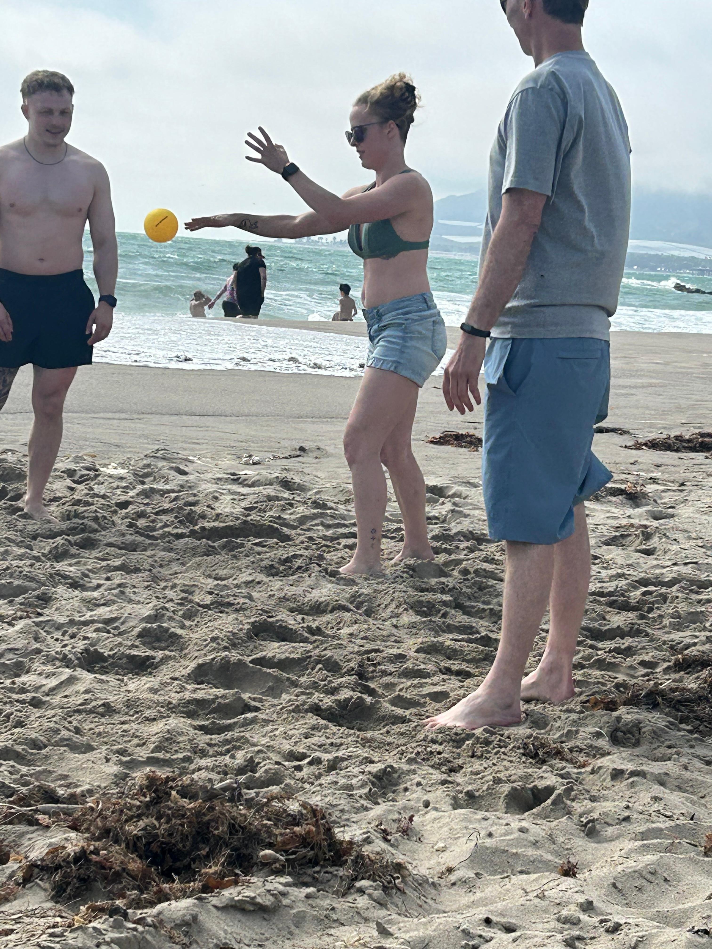 Playing spike ball on the beach