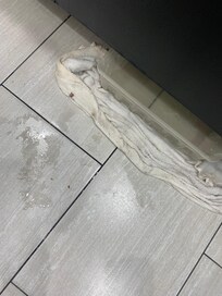 Floor in front of breakfast counter