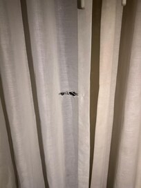 Curtain is messed up and is dirty
Has a cut on it.