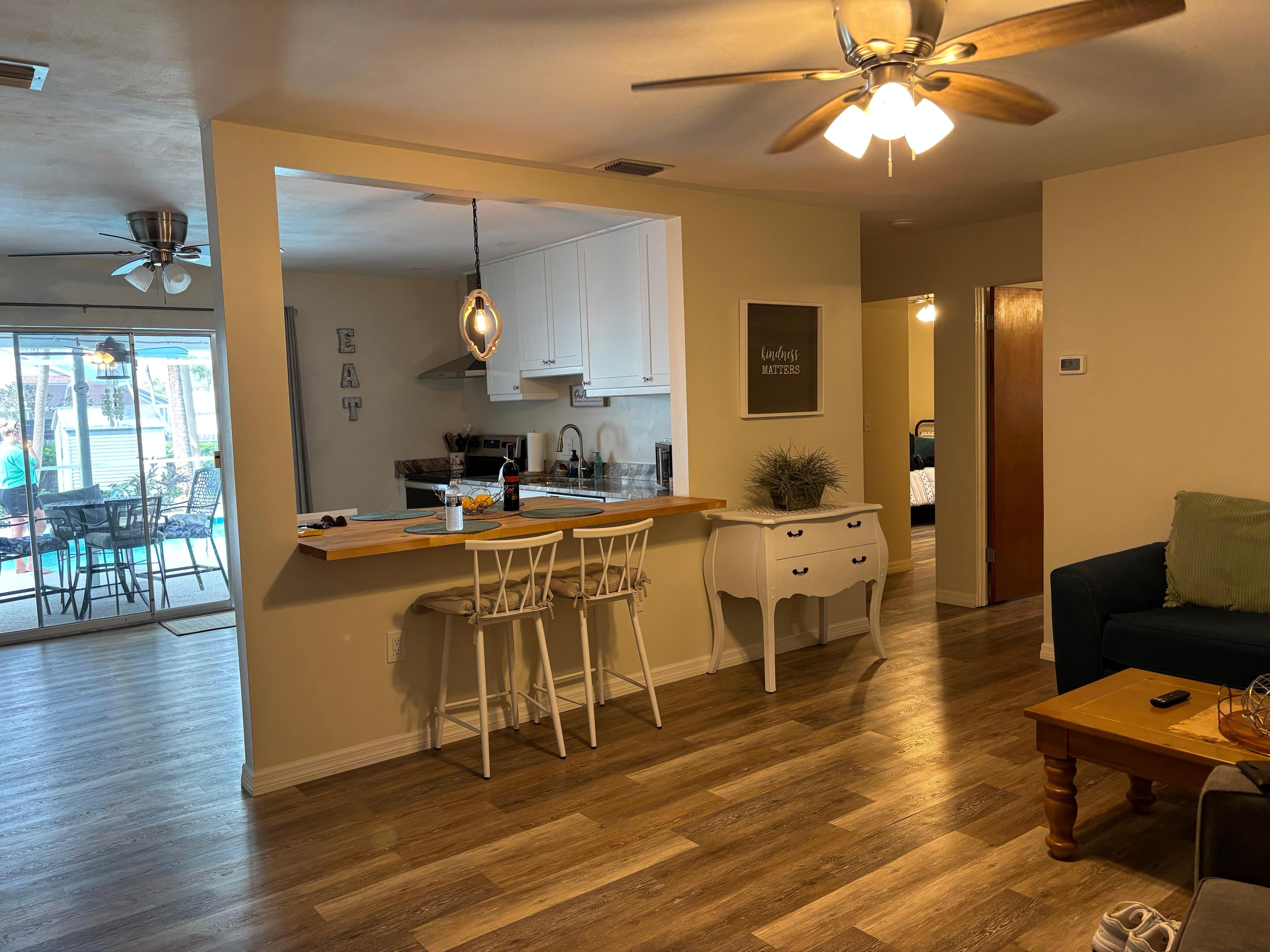 Looking from front door into kitchen and living room 