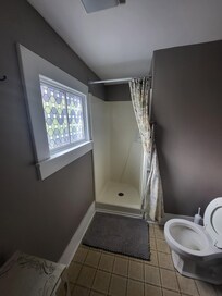 Upstairs bath in need of more shelving.