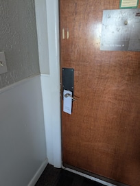 Wooden front door with interior house lock. Not even a chain security backup let alone a deadbolt.