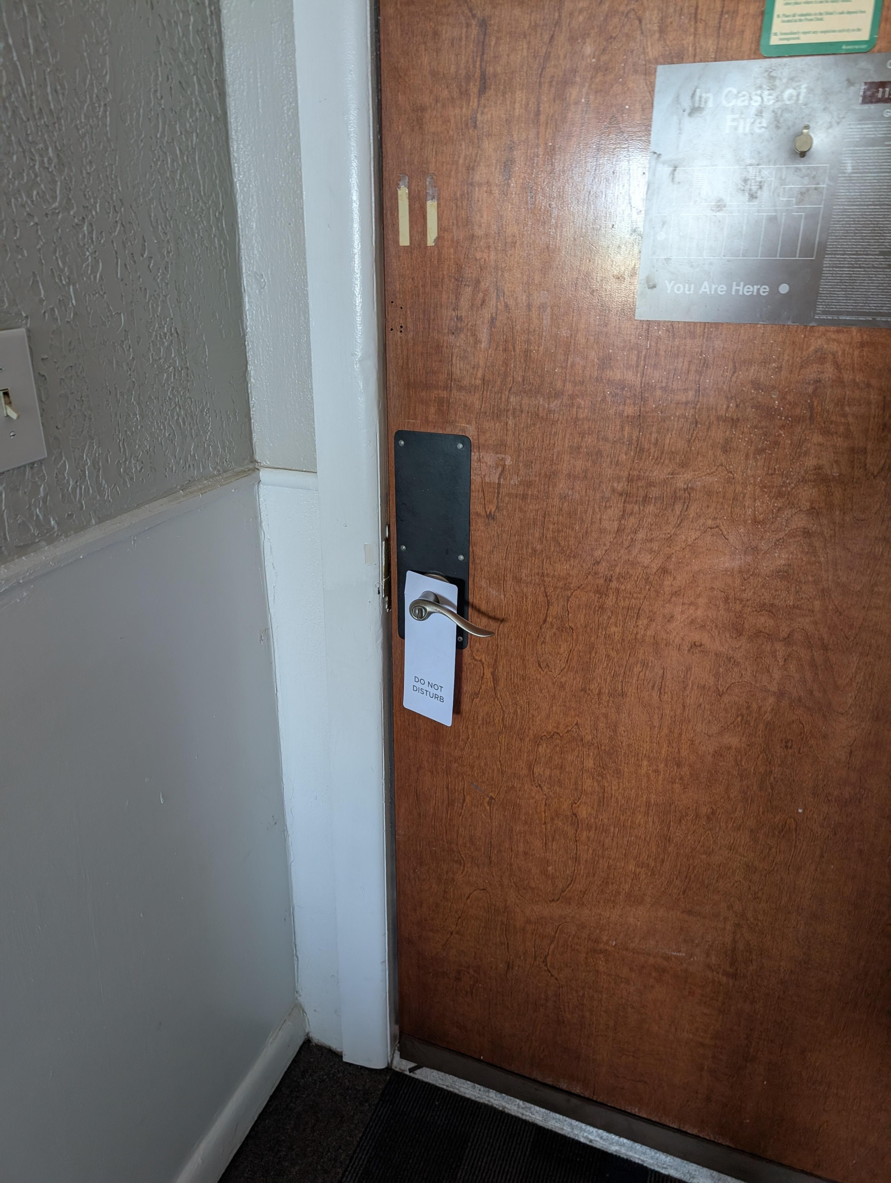 Wooden front door with interior house lock. Not even a chain security backup let alone a deadbolt.