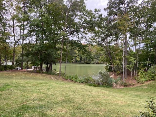 View of the property, dock, and water from the house