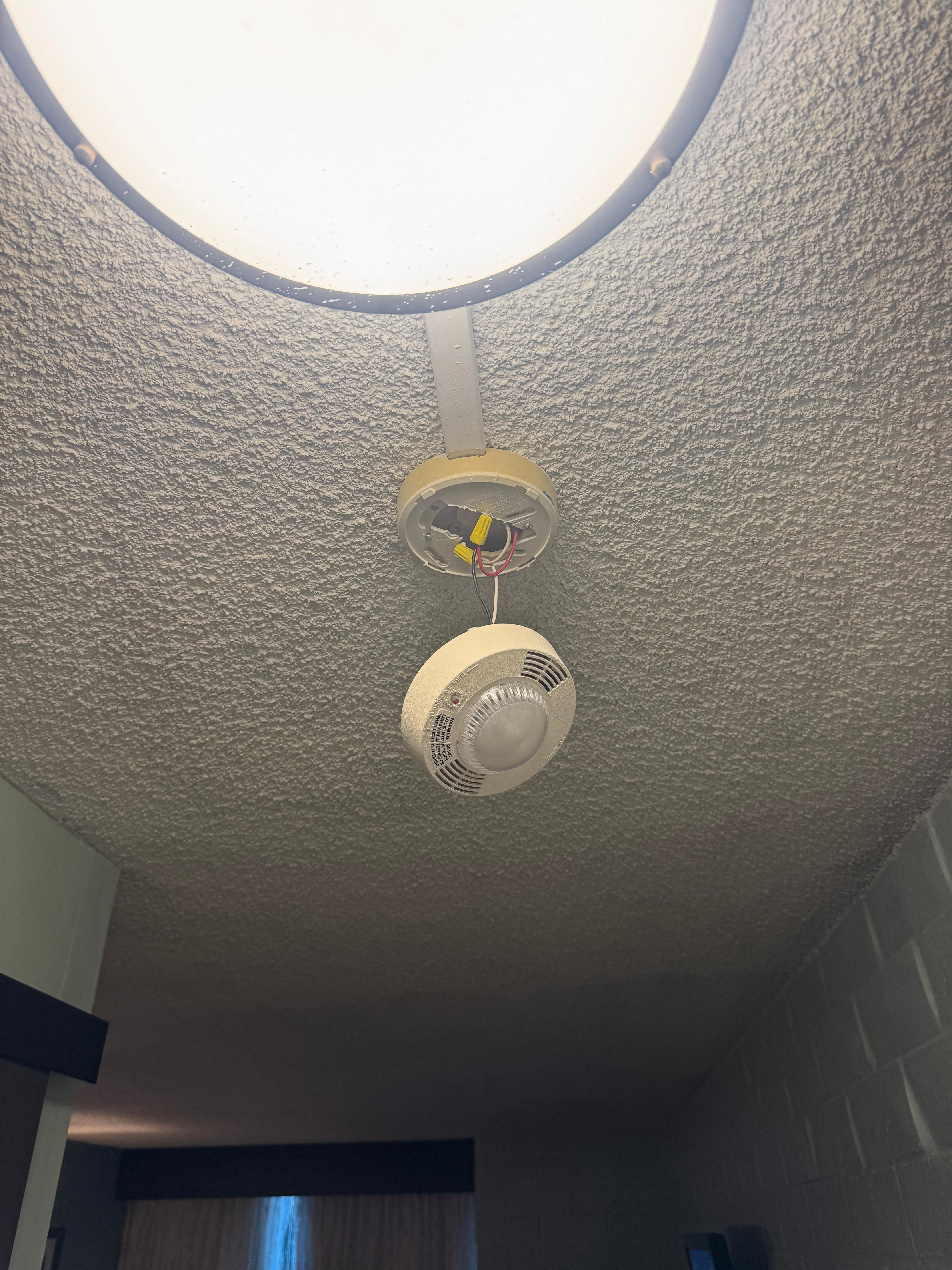 Smoke/Fire alarm hanging from wires