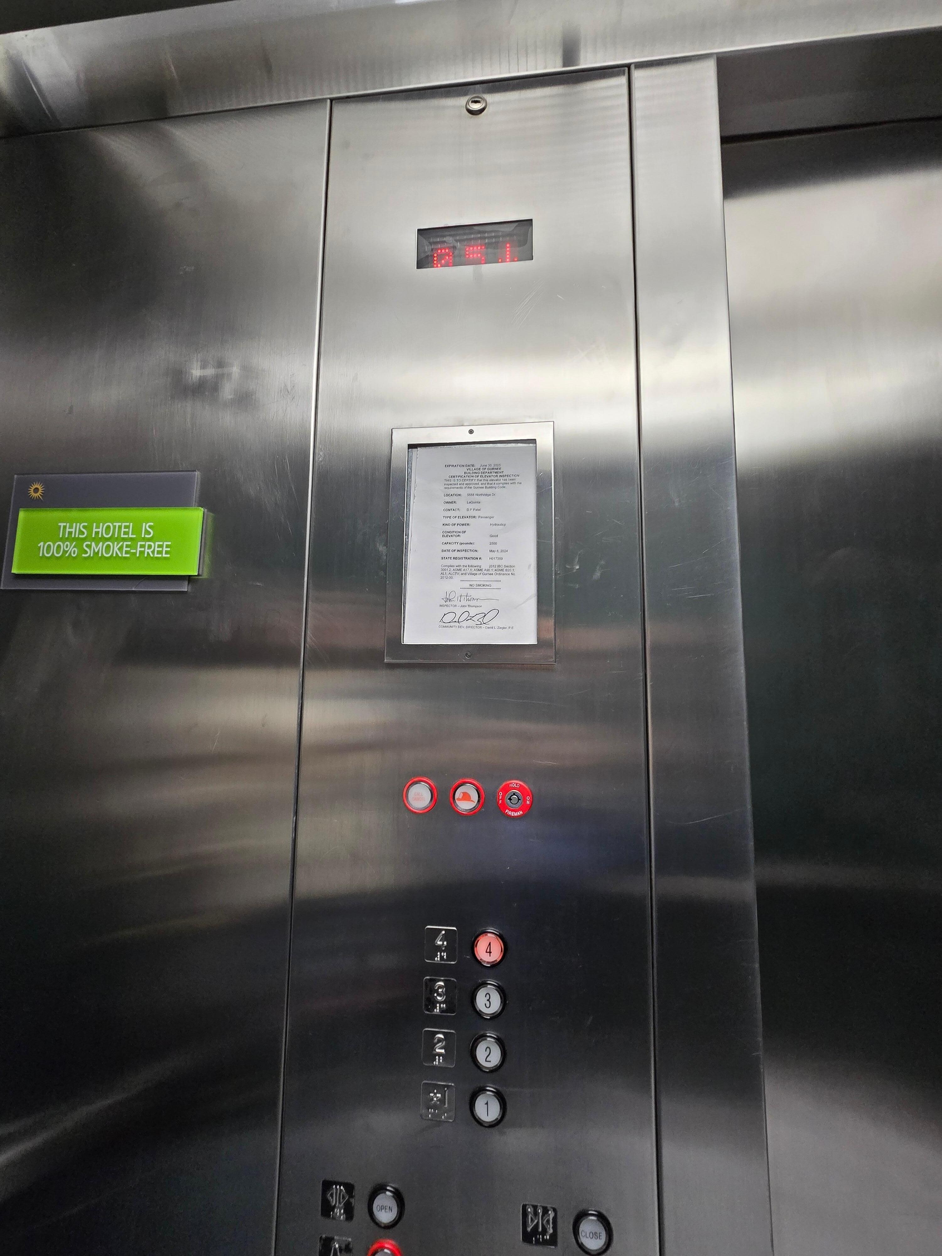 Elevator displays 5th floor and buttons show only 4 floors!