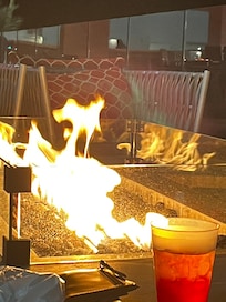 Fire pit out by the pool