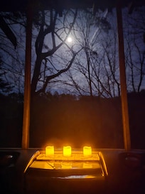 Hot tub under the moon by candlelight.