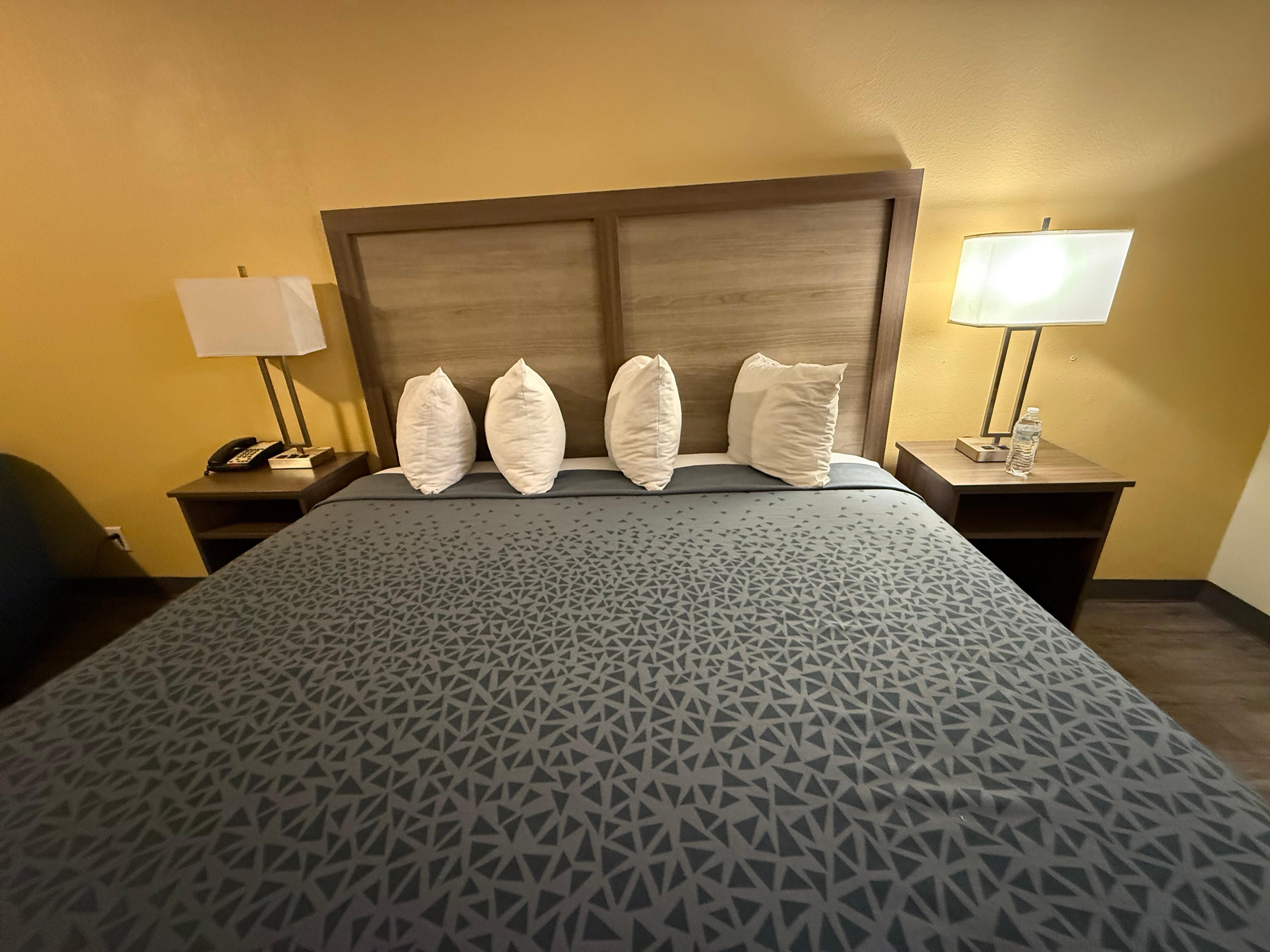 At the foot of the bed, pillows are obviously not regular sized.