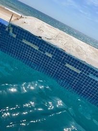 Tiles coming off all over the pool