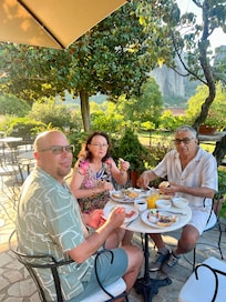 Delicious local Greek buffet breakfast and the beautiful warmth on the lanai outside of the hotel.