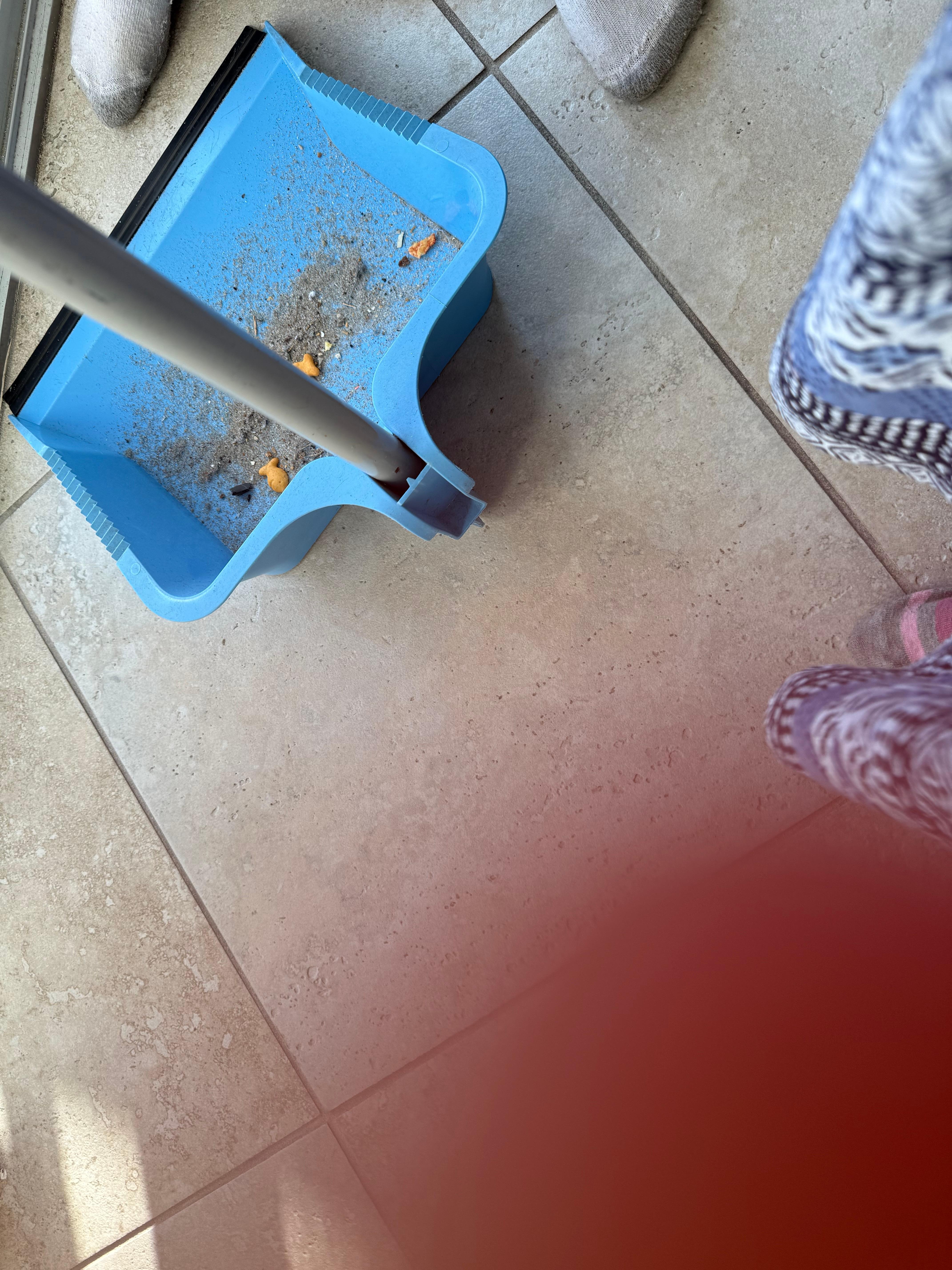 Sweeping the kitchen right after checking in