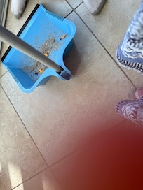 Sweeping the kitchen right after checking in