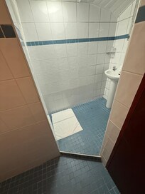 Moldy bathroom with six foot ceiling