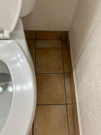 Fingernails and dirt on bathroom floor