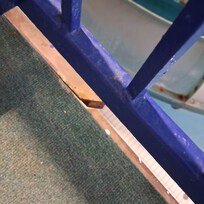 Broken in half metal piece on edge of deck