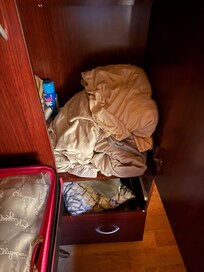 Dirty linens piled up on the closet
