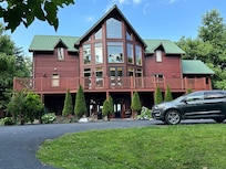 My granddaughter resting at the massive table we ate at, played games around and just sat and talked together all week.