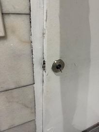 Bathroom door couldn’t shut. Handle was sitting on but would fall right off.