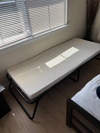Rollaway bed, listing says a twin bed and we didn’t have bedding for this bed. We were a party of 4.