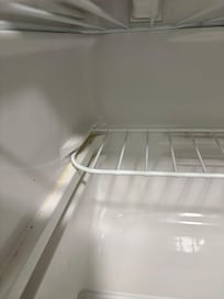 Inside a refrigerator everything was frozen and fridge was not clean