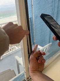 Window seal rotted at the bottom and all along the side. I can swing from side to side with the wind.