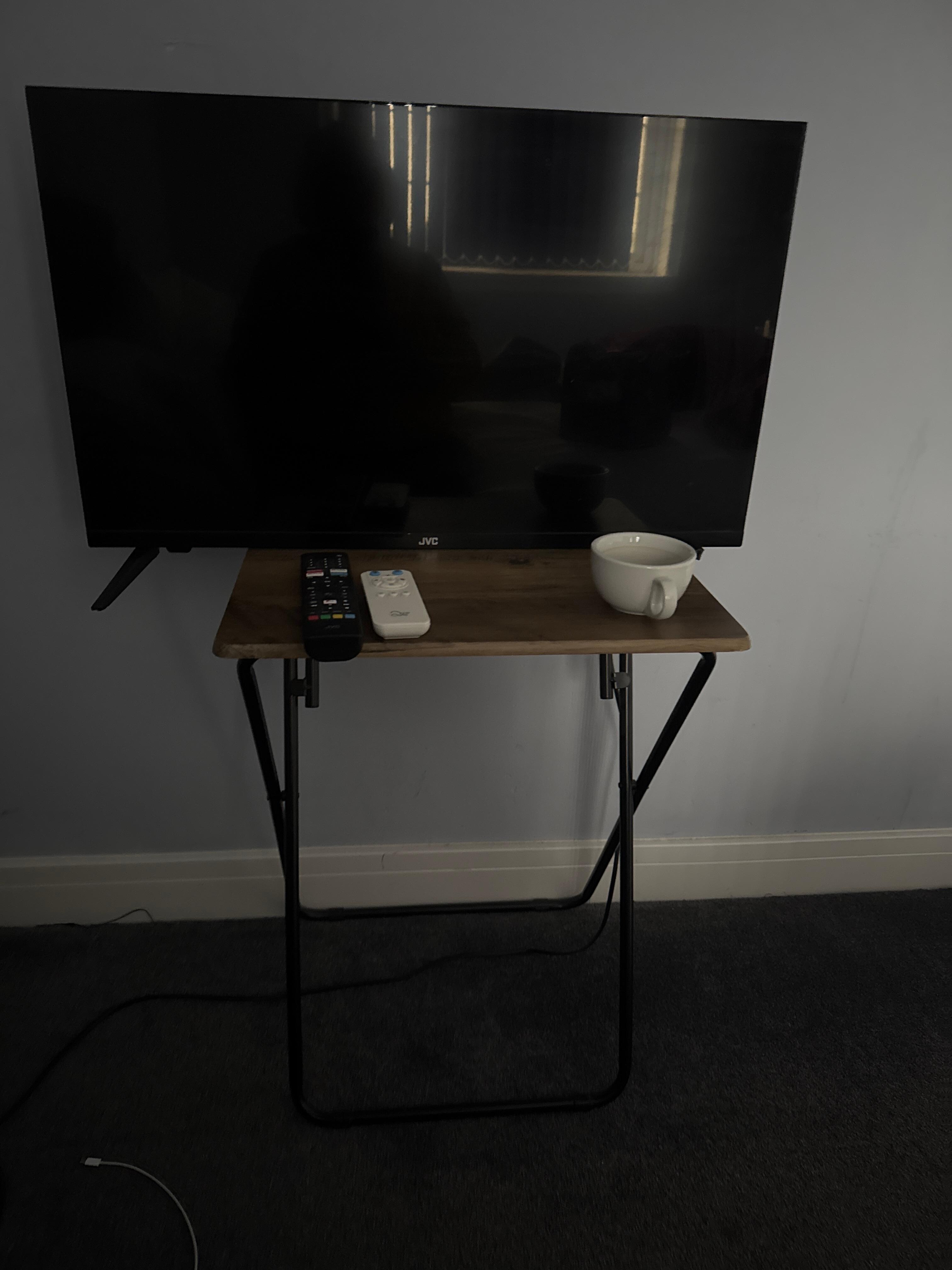Television on flimsy table but not set up , I could not access any TV channels 