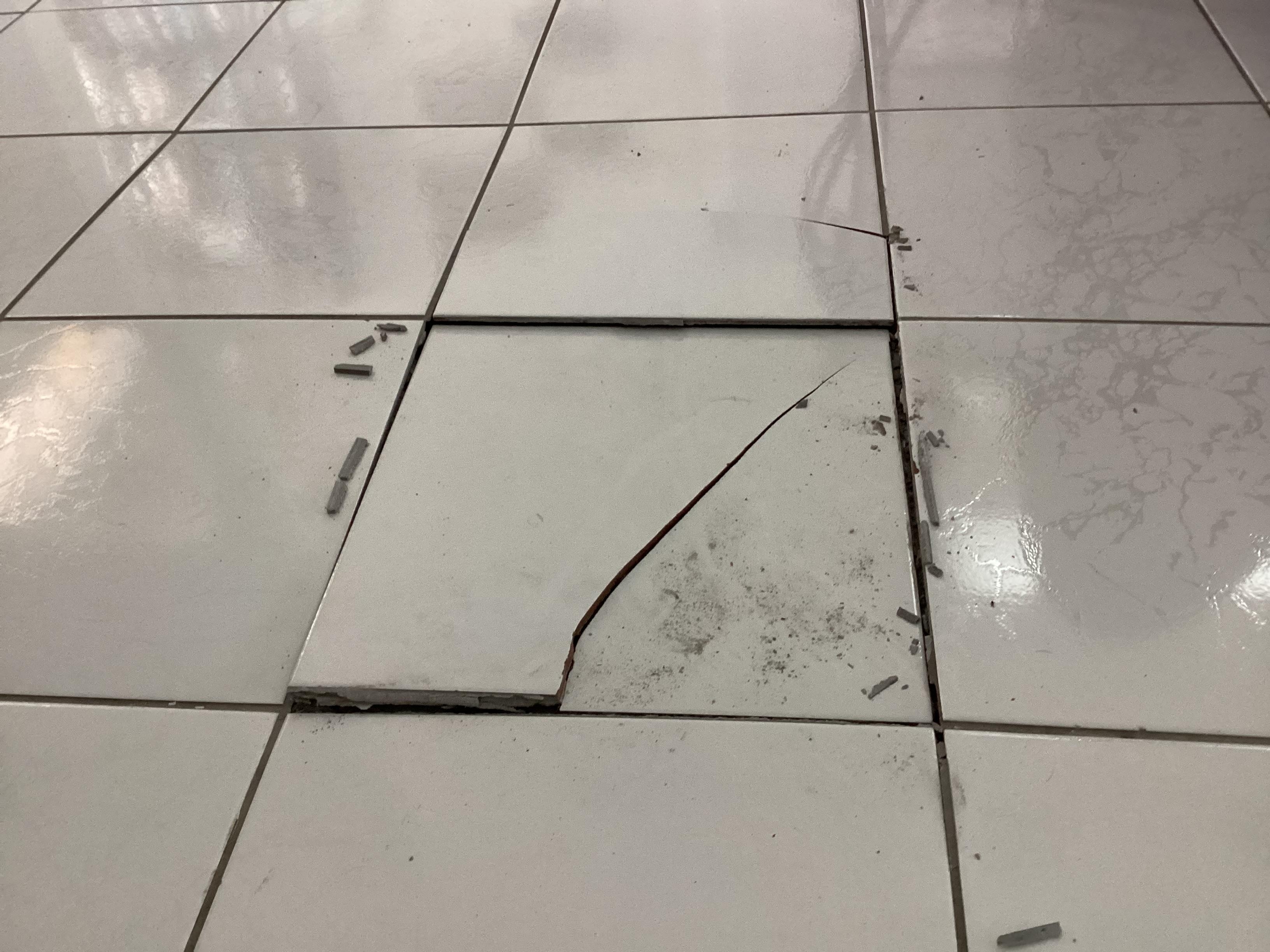 Squishy floor with buckling/cracked tile