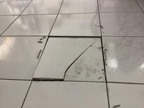 Squishy floor with buckling/cracked tile