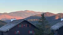 Sunrise view of Mt. Washington from the bay window inside the condo.