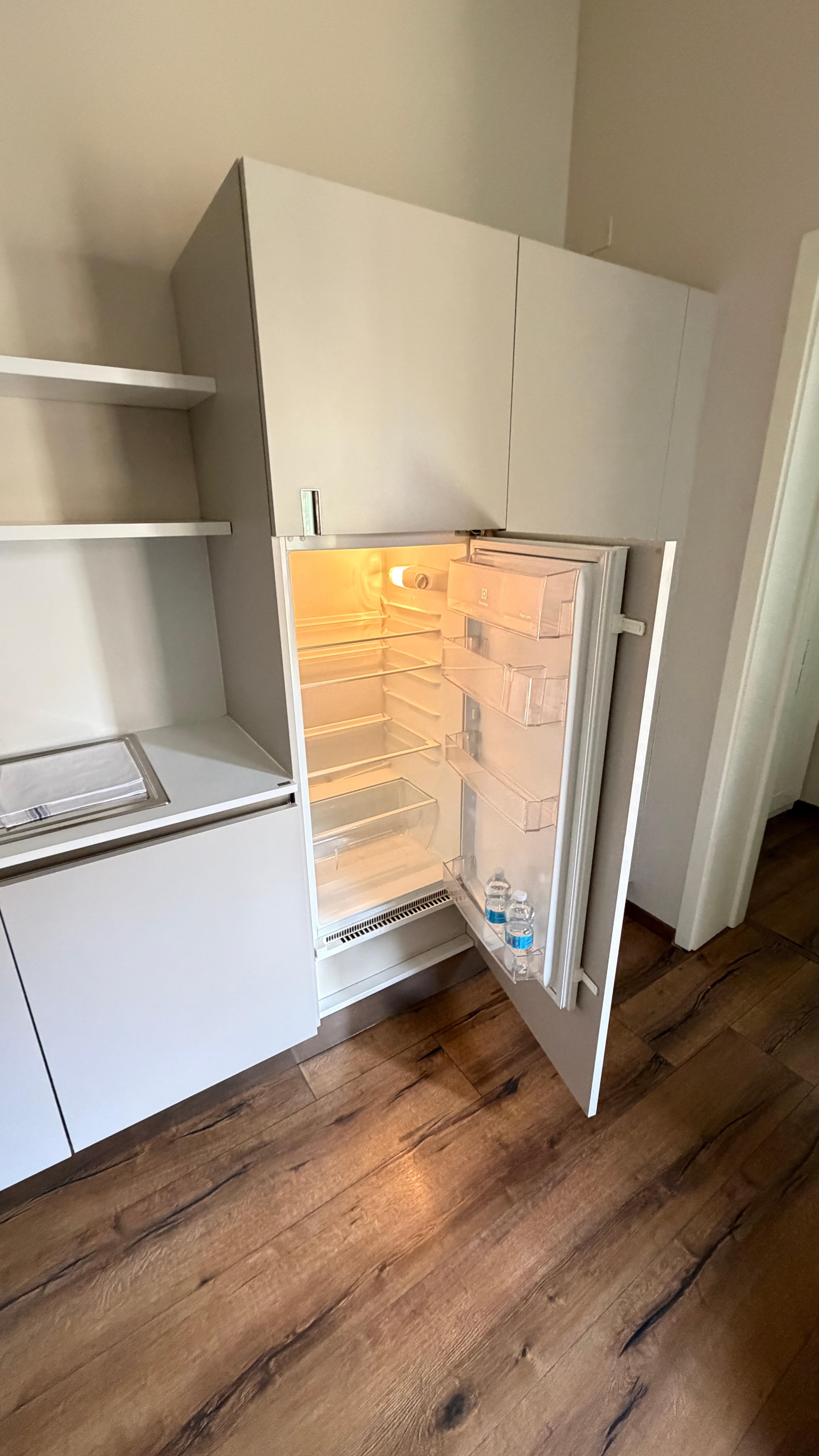 Refrigerator freezer is behind the door immediately above the refrigerator.