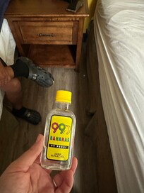 Bottle of liquor found under bed