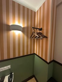 No closet - only hangers and a small rail .