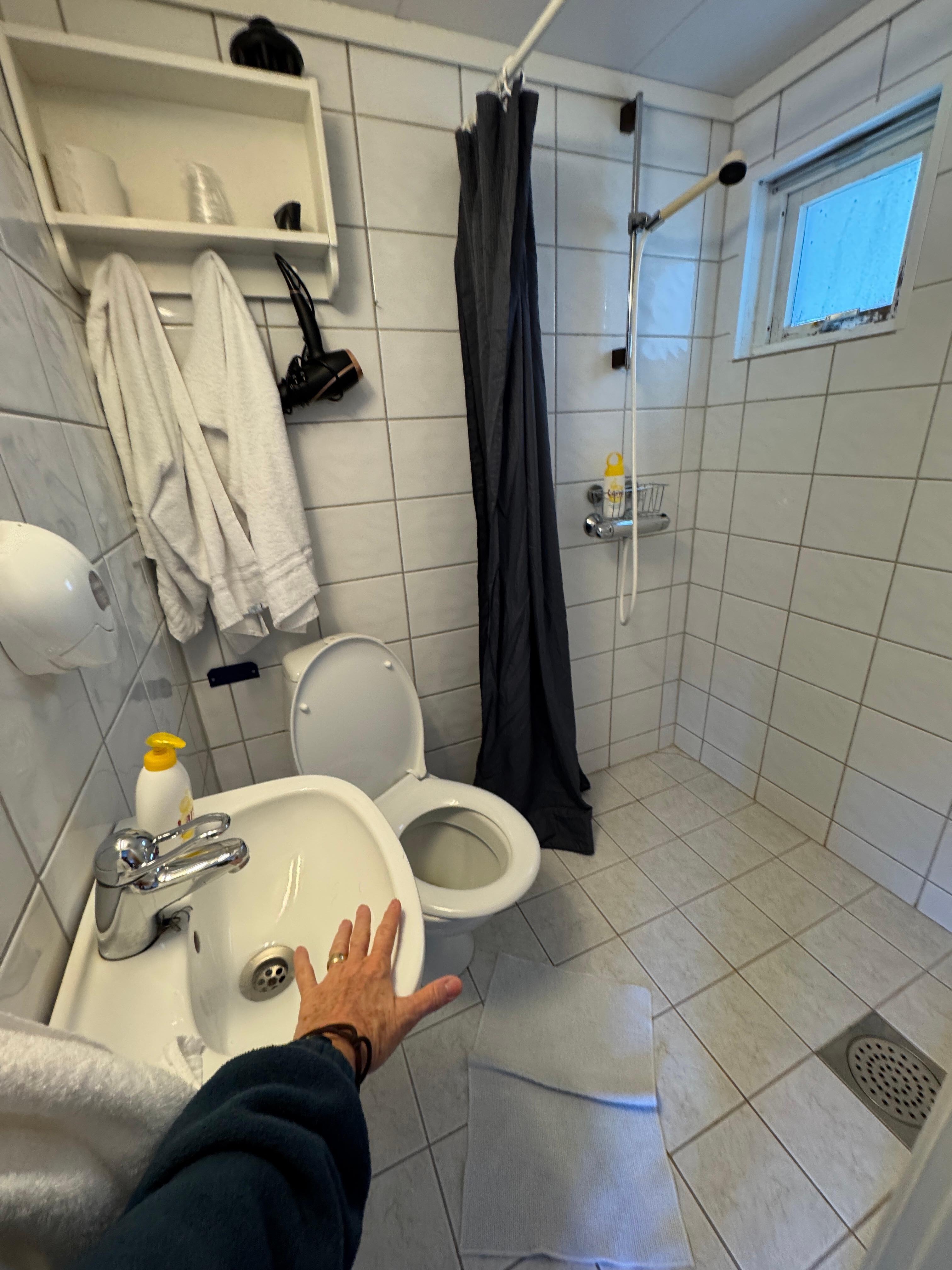 Very small bath, Hand soap for sink and shower. No other bath amenities.Floor was heated, so it dry fairly quickly.