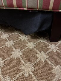 Underside of furniture torn and hanging down