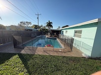 Pool surrounded by fence NOT in any pictures and ruined pool side enjoyment.