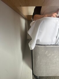 Huge gap behind the bed where the pillows kept falling through to the floor.Caused by the lip on the ground.