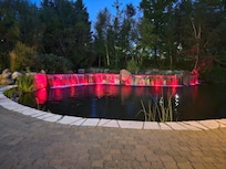 Long lane way in surrounded by gardens and ponds