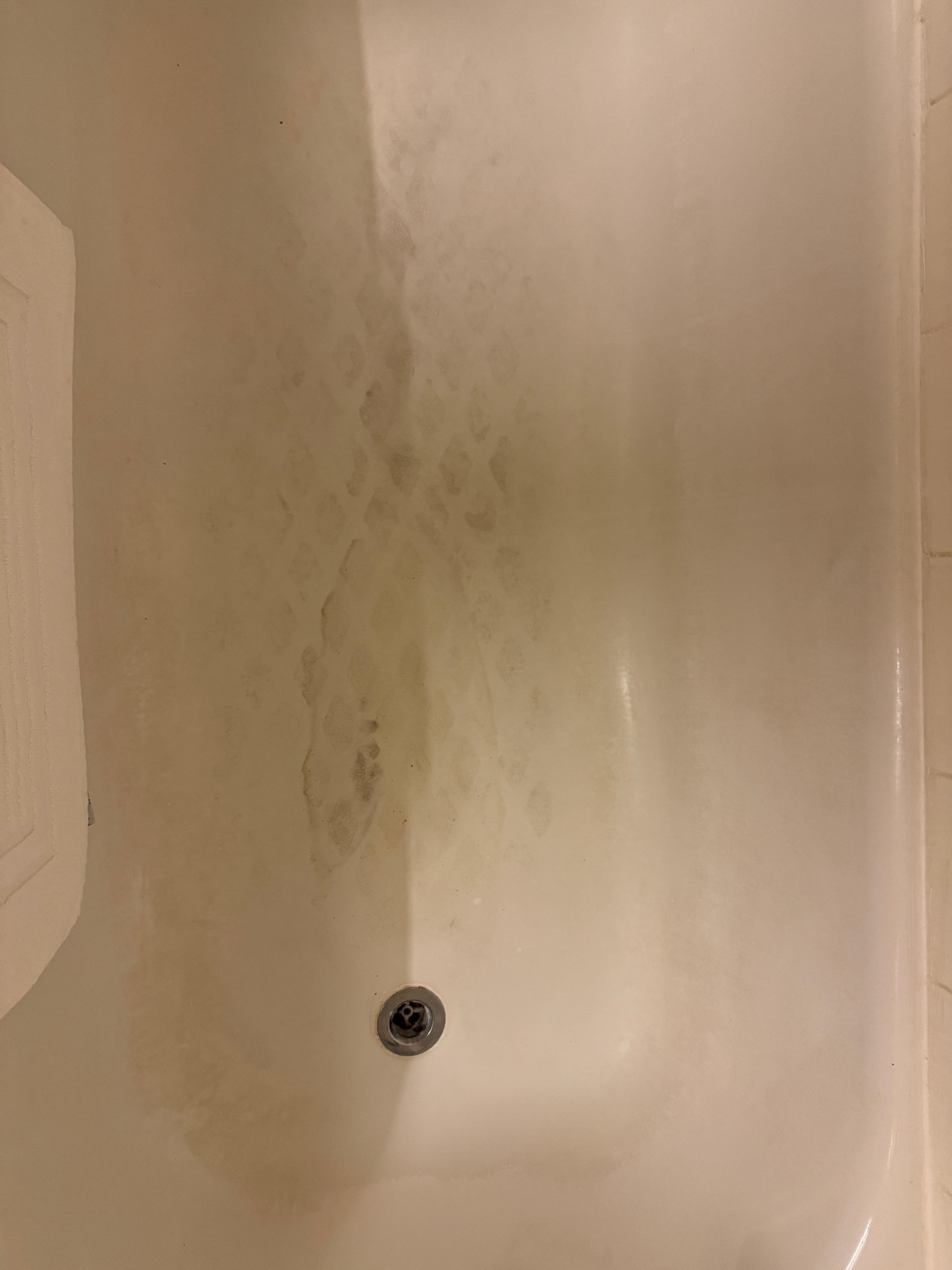 Bath floor. This is soap scum built up from not scrubbing