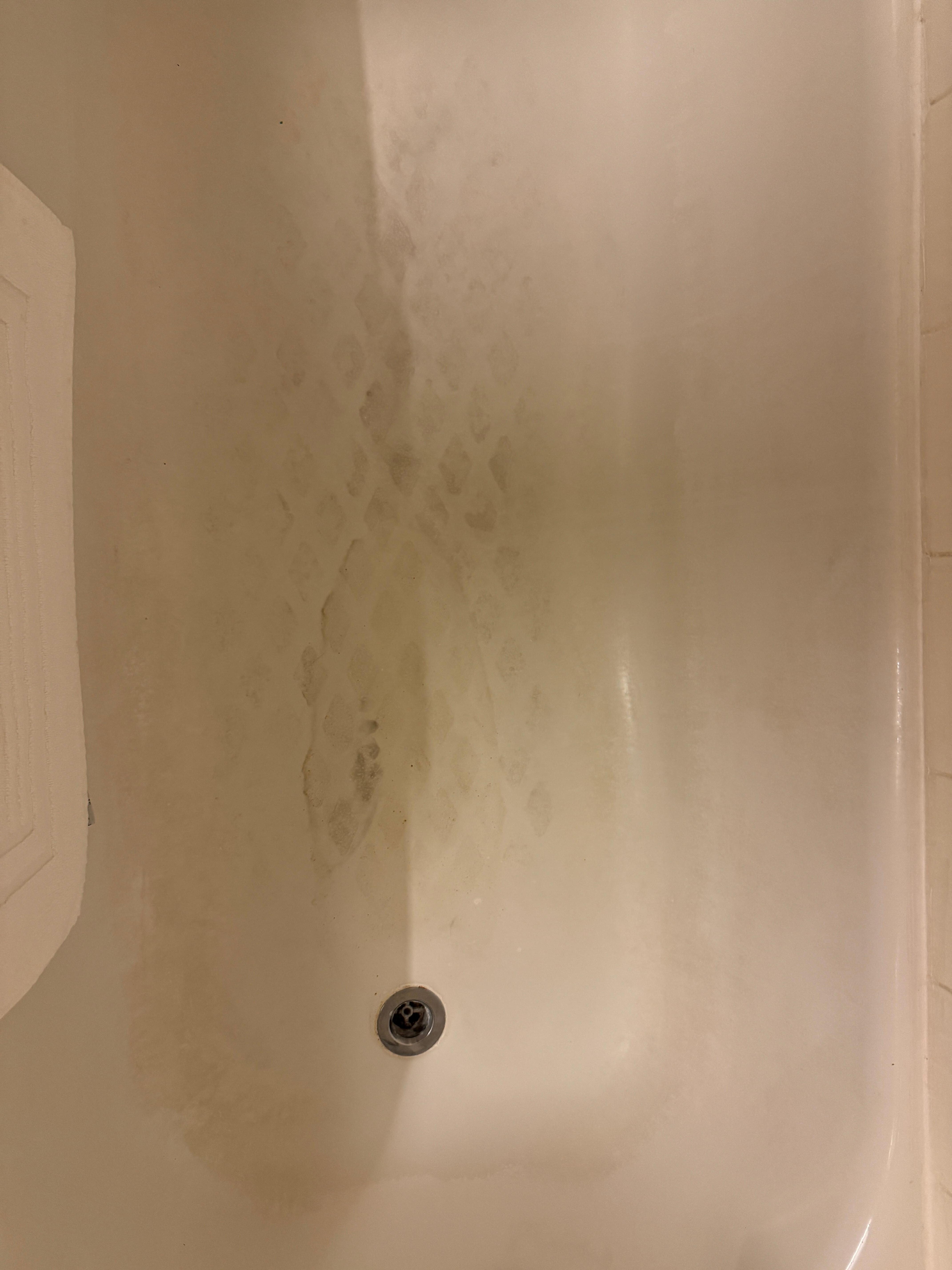 Bath floor. This is soap scum built up from not scrubbing 