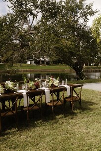 We got married in front of the beautiful oak tree. The sidewalk is a perfect "aisle". We were able to fit 20 people in chairs on the concrete pad comfortably. Dinner and cocktail hour were right next to the ceremony site