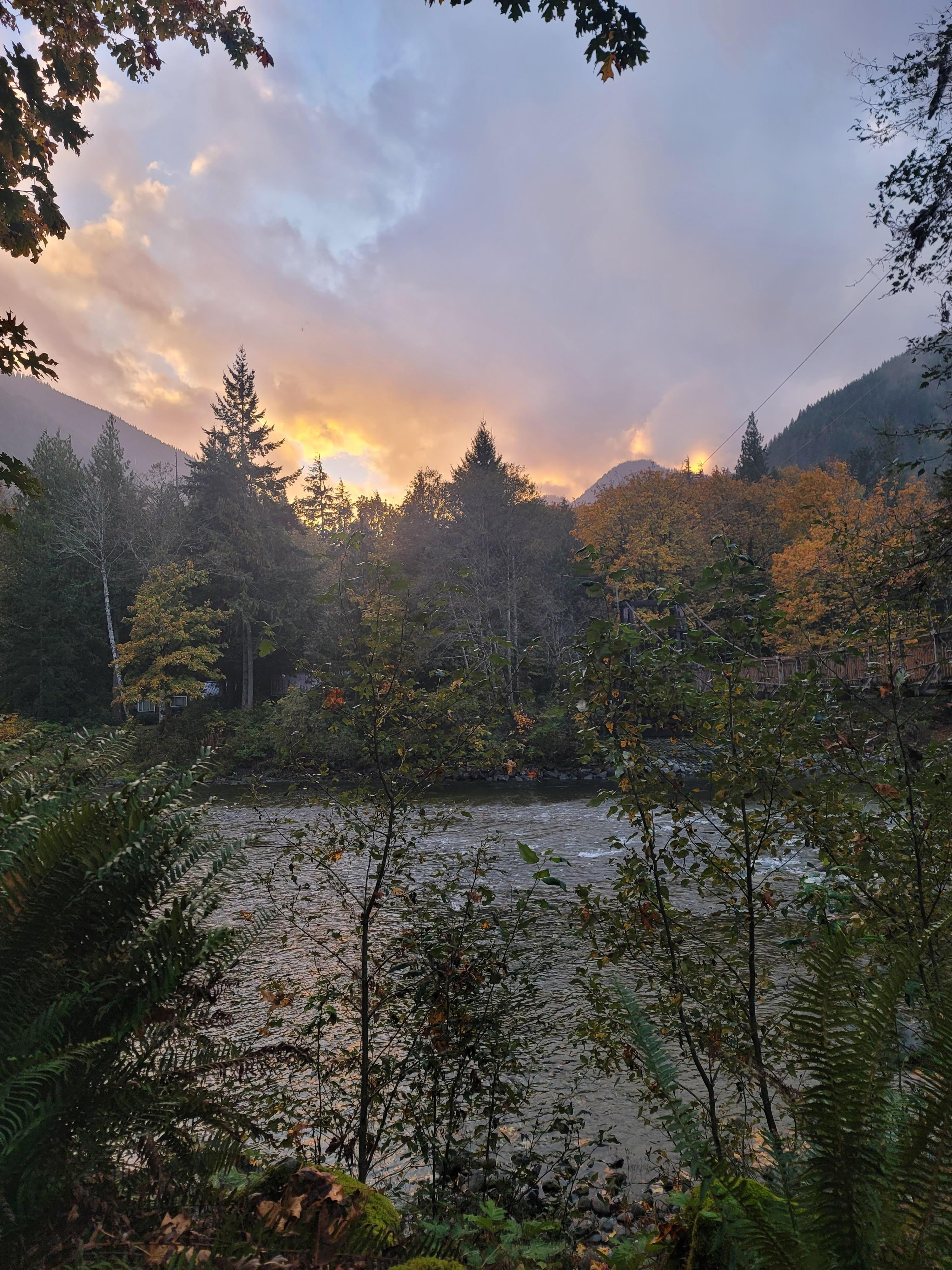 Sunset was amazing. Especially with the fall backdrop of trees. 

No matter where you sit, you can enjoy the river.

I loved sitting outside under the covered part of the porch.Listening to the rain and the running river while I read a book