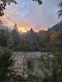 Sunset was amazing. Especially with the fall backdrop of trees.
No matter where you sit, you can enjoy the river.
I loved sitting outside under the covered part of the porch.Listening to the rain and the running river while I read a book