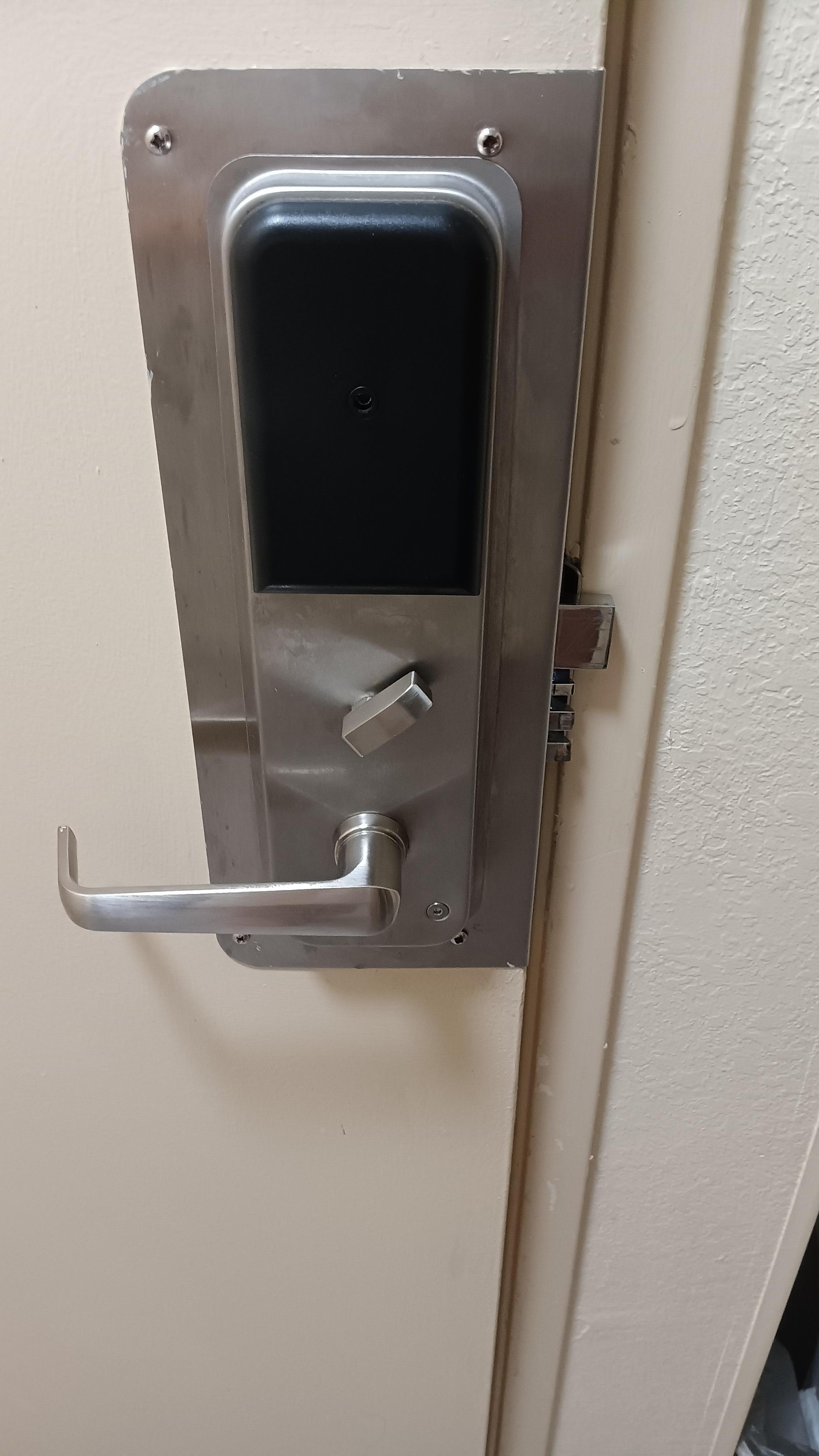 Deadbolt out of doorframe.  Note position of deadbolt lever.