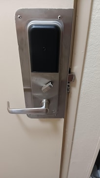 Deadbolt out of doorframe. Note position of deadbolt lever.