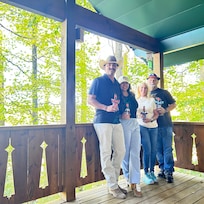 Fall leaves in the background and on the lower porch.