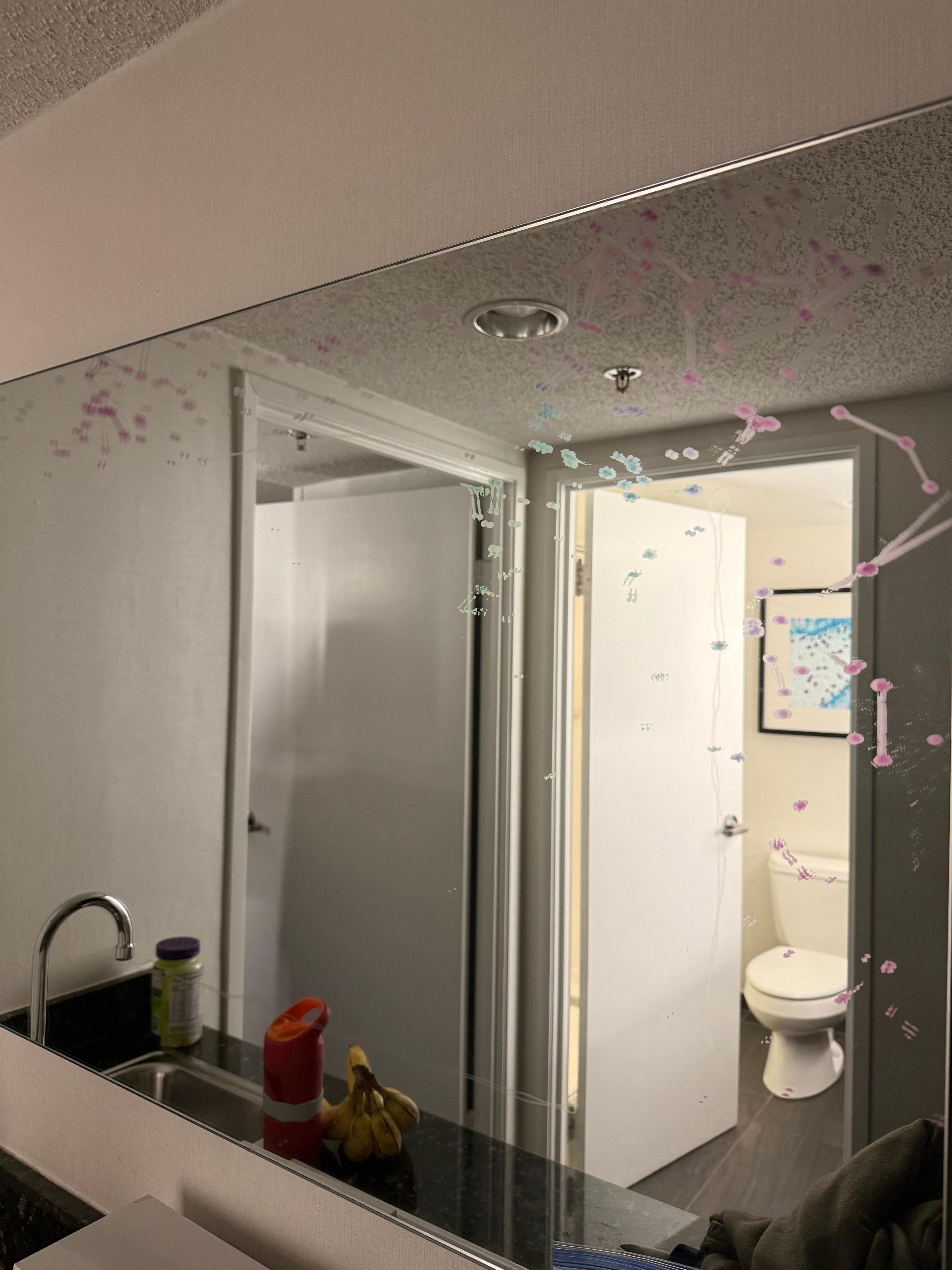 In addition to design on mirror that was halfway removed (we thought it was marker), it had other water streaks all over