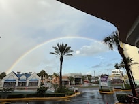 Waiting for a grocery delivery with an early morning double rainbow