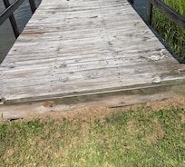 Uneven and lose board with large splinter toward the center(tripping hazard)